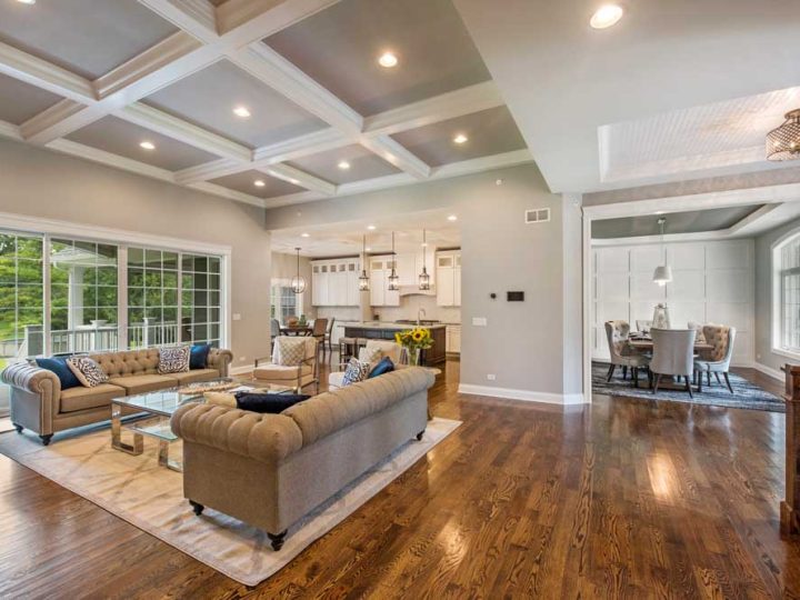 Great room with coffered ceiling and large windows