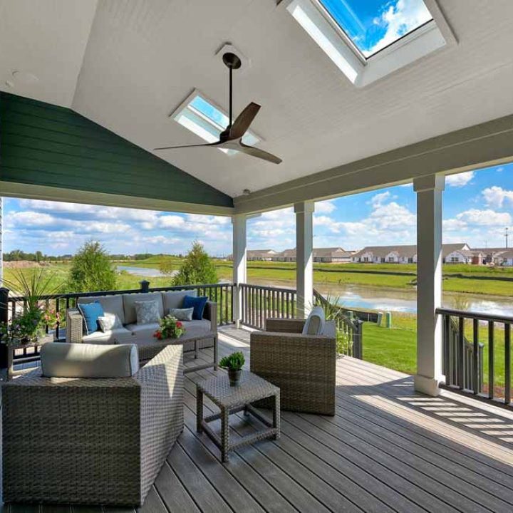 beautiful deck in the back of a new house to gather on a beautiful day