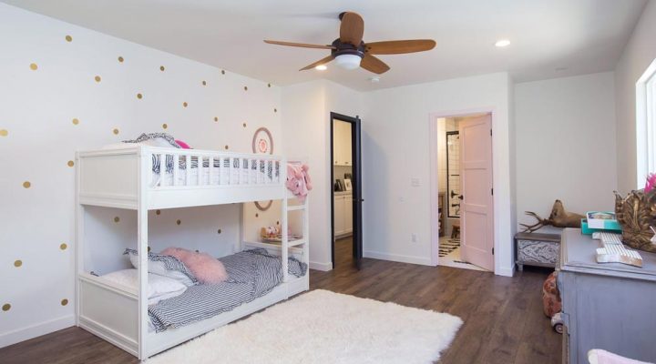 newly added kids room, white painted bunker beds, white carpet and hardwood flooring
