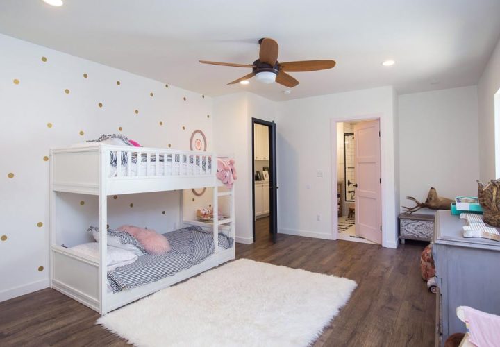 newly added kids room, white painted bunker beds, white carpet and hardwood flooring
