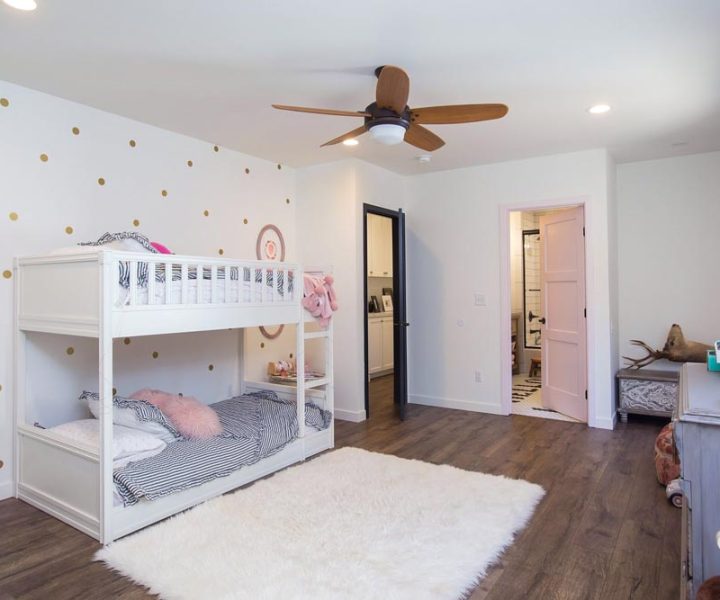 newly added kids room, white painted bunker beds, white carpet and hardwood flooring